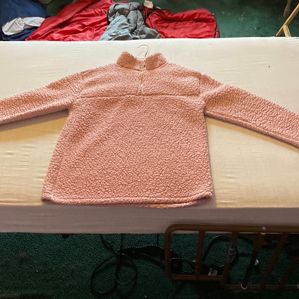 Pink long sleeve zip up sweater with fur in the inside